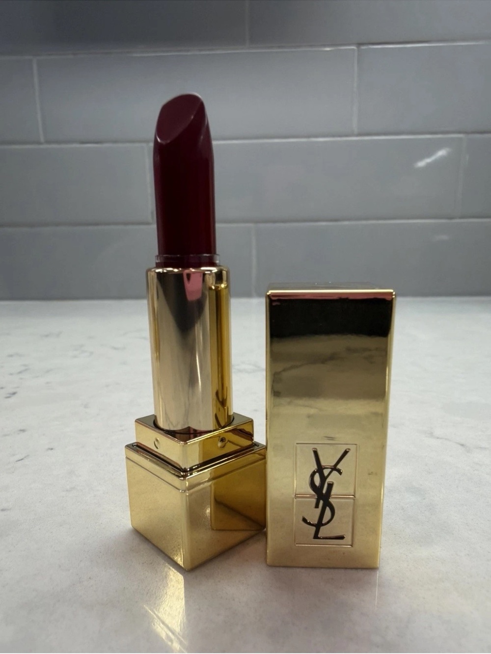 Yves Saint Laurent Gold Lipstick Case with Deep Berry Shade